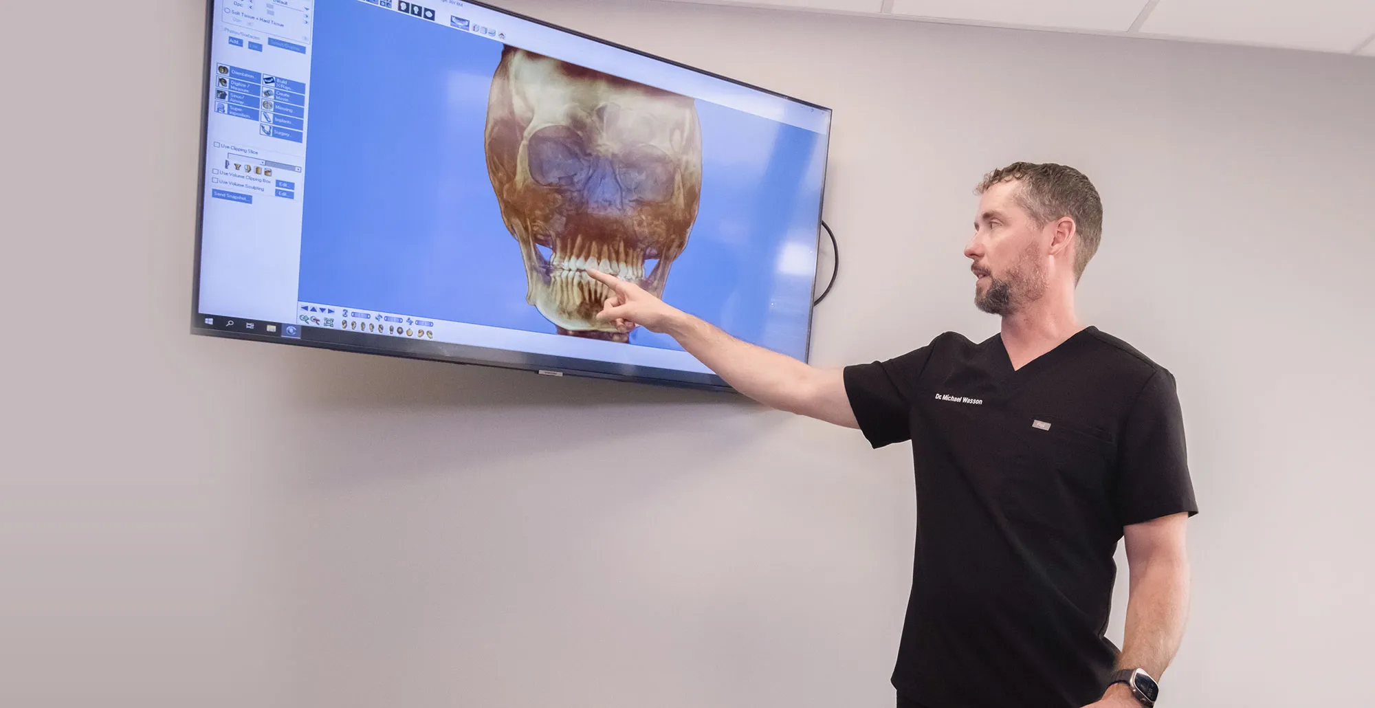 Dr Wasson explaining graphic on the tv